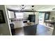 Modern kitchen features white cabinets, granite countertops, and stainless steel appliances at 170 Briar Hill Dr, Whiteland, IN 46184