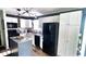 Well-lit kitchen with white cabinetry, granite countertops, and modern appliances at 170 Briar Hill Dr, Whiteland, IN 46184