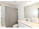 Bright bathroom featuring a shower-tub combo and vanity with quartz countertop and chrome faucet at 19442 Honeylocust Glen, Noblesville, IN 46062