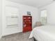 Well-lit bedroom with bright windows, carpet, and decorative bookcase at 19442 Honeylocust Glen, Noblesville, IN 46062