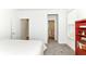 Bedroom with carpet, closet and bathroom access, and decorative bookcase at 19442 Honeylocust Glen, Noblesville, IN 46062
