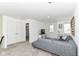 Bright living room featuring a comfortable grey sectional couch, TV and storage, and neutral walls at 19442 Honeylocust Glen, Noblesville, IN 46062