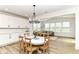 Bright room with open floor plan, dining area and multiple windows for natural light at 19442 Honeylocust Glen, Noblesville, IN 46062