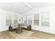 Inviting living room with many windows, vaulted ceiling, and neutral decor at 19442 Honeylocust Glen, Noblesville, IN 46062