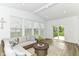 Bright living room with vaulted ceiling, natural light and sliding doors at 19442 Honeylocust Glen, Noblesville, IN 46062