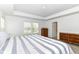 Bright bedroom featuring neutral walls and carpeting and a bed with striped linens at 19442 Honeylocust Glen, Noblesville, IN 46062