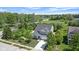 Aerial view of a two-story house with nice landscaping and a long driveway at 19570 Forsythe Dr, Noblesville, IN 46060
