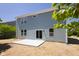 Backyard view of the home's exterior, showcasing a concrete patio and light blue siding at 19570 Forsythe Dr, Noblesville, IN 46060