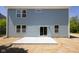 Backyard view showcasing a concrete patio and the home's light blue exterior at 19570 Forsythe Dr, Noblesville, IN 46060