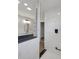 Modern bathroom featuring a glass shower, and navy vanity with a granite countertop at 19570 Forsythe Dr, Noblesville, IN 46060
