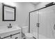 Bright bathroom with a modern vanity, toilet, and glass-enclosed shower with black trim at 19570 Forsythe Dr, Noblesville, IN 46060