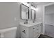 Modern bathroom featuring double sink vanity with marble countertop and matte black fixtures at 19570 Forsythe Dr, Noblesville, IN 46060