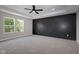 A spacious bedroom features a tray ceiling, and a striking black accent wall at 19570 Forsythe Dr, Noblesville, IN 46060