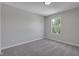 Bright bedroom featuring neutral paint, plush carpeting, and a window at 19570 Forsythe Dr, Noblesville, IN 46060