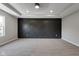 An empty bedroom features an attractive black accent wall and tray ceiling at 19570 Forsythe Dr, Noblesville, IN 46060