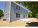 Back exterior of the house with light blue siding and a concrete patio at 19570 Forsythe Dr, Noblesville, IN 46060