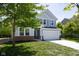 Attractive two-story home with a two-car garage and a lush green front yard at 19570 Forsythe Dr, Noblesville, IN 46060