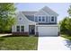 Charming two-story home featuring a two-car garage and beautifully landscaped front yard at 19570 Forsythe Dr, Noblesville, IN 46060