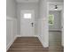 Bright foyer with wood-look floors, showcasing the entrance to a welcoming living space at 19570 Forsythe Dr, Noblesville, IN 46060