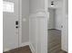 Elegant foyer with wood-look floors and a view into the living area, perfect for welcoming guests at 19570 Forsythe Dr, Noblesville, IN 46060