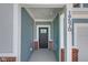 Inviting front porch with brick accents and a stylish front door, showcasing the home's entrance at 19570 Forsythe Dr, Noblesville, IN 46060