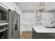Well-appointed kitchen with stainless steel appliances, white cabinets, and a modern island at 19570 Forsythe Dr, Noblesville, IN 46060