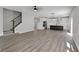 Open-concept living room showcases modern finishes and flows into the kitchen with stainless steel appliances at 19570 Forsythe Dr, Noblesville, IN 46060