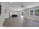 Open-concept living space flowing into the kitchen, featuring hardwood floors and plenty of natural light at 19570 Forsythe Dr, Noblesville, IN 46060