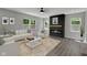 Well-decorated living room with comfortable seating, fireplace, large windows, and stylish decor enhancing the ambiance at 19570 Forsythe Dr, Noblesville, IN 46060