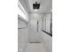 Sleek walk-in shower features marble tiling, black hardware, and recessed shelving at 19570 Forsythe Dr, Noblesville, IN 46060