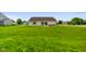 Spacious backyard featuring green grass, a patio set, ideal for outdoor activities and relaxation at 204 Oakview Dr, Mooresville, IN 46158