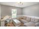 Bedroom featuring paneled walls, a window and a pull-out sofa at 204 Oakview Dr, Mooresville, IN 46158