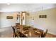 Spacious dining room with tray ceiling, neutral walls, and decorative lighting at 204 Oakview Dr, Mooresville, IN 46158