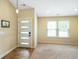 Bright entryway featuring a modern door, neutral paint, and tile flooring at 204 Oakview Dr, Mooresville, IN 46158