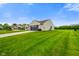 Attractive home with a manicured lawn, attached garage, and a neatly paved driveway in a residential neighborhood at 204 Oakview Dr, Mooresville, IN 46158