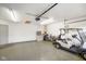 Spacious garage featuring speckled epoxy flooring, overhead lighting, and ample storage space for vehicles and equipment at 204 Oakview Dr, Mooresville, IN 46158