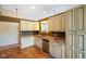 Well-lit kitchen with tile flooring, granite counters, and ample storage space at 204 Oakview Dr, Mooresville, IN 46158