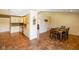 Open concept design with kitchen with dining room, decorative art and earth-toned tile flooring at 204 Oakview Dr, Mooresville, IN 46158
