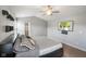 Bright main bedroom featuring a ceiling fan, and an ensuite bathroom at 204 Oakview Dr, Mooresville, IN 46158