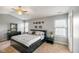 Bright main bedroom featuring a ceiling fan, a large window and neutral carpeting at 204 Oakview Dr, Mooresville, IN 46158