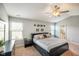 Bright main bedroom featuring a ceiling fan, a large window and an ensuite bathroom at 204 Oakview Dr, Mooresville, IN 46158