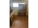 A dining room featuring two wooden china cabinets and hardwood floors at 2146 Gent Ave, Indianapolis, IN 46202