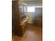 A dining room featuring two wooden china cabinets and hardwood floors at 2146 Gent Ave, Indianapolis, IN 46202