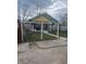 Street view of a fenced yard with a two-story house with front porch at 2146 Gent Ave, Indianapolis, IN 46202