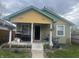 Charming, two-story home with a covered front porch and landscaping at 2146 Gent Ave, Indianapolis, IN 46202
