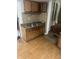A kitchen with wooden cabinets, double sink, and tile backsplash at 2146 Gent Ave, Indianapolis, IN 46202