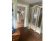 Spacious living room featuring hardwood floors and glass cabinets at 2146 Gent Ave, Indianapolis, IN 46202