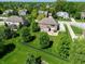 Lush green backyard and mature landscaping with a wrought iron fence in a desirable residential neighborhood at 2219 Stone Manor Ct, Avon, IN 46123