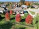 Aerial view of home with fenced yard, beautiful fall foliage, and outdoor play equipment at 2219 Stone Manor Ct, Avon, IN 46123