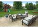 Outdoor patio area with furniture and fire pit, plus a grassy yard with play set at 2219 Stone Manor Ct, Avon, IN 46123